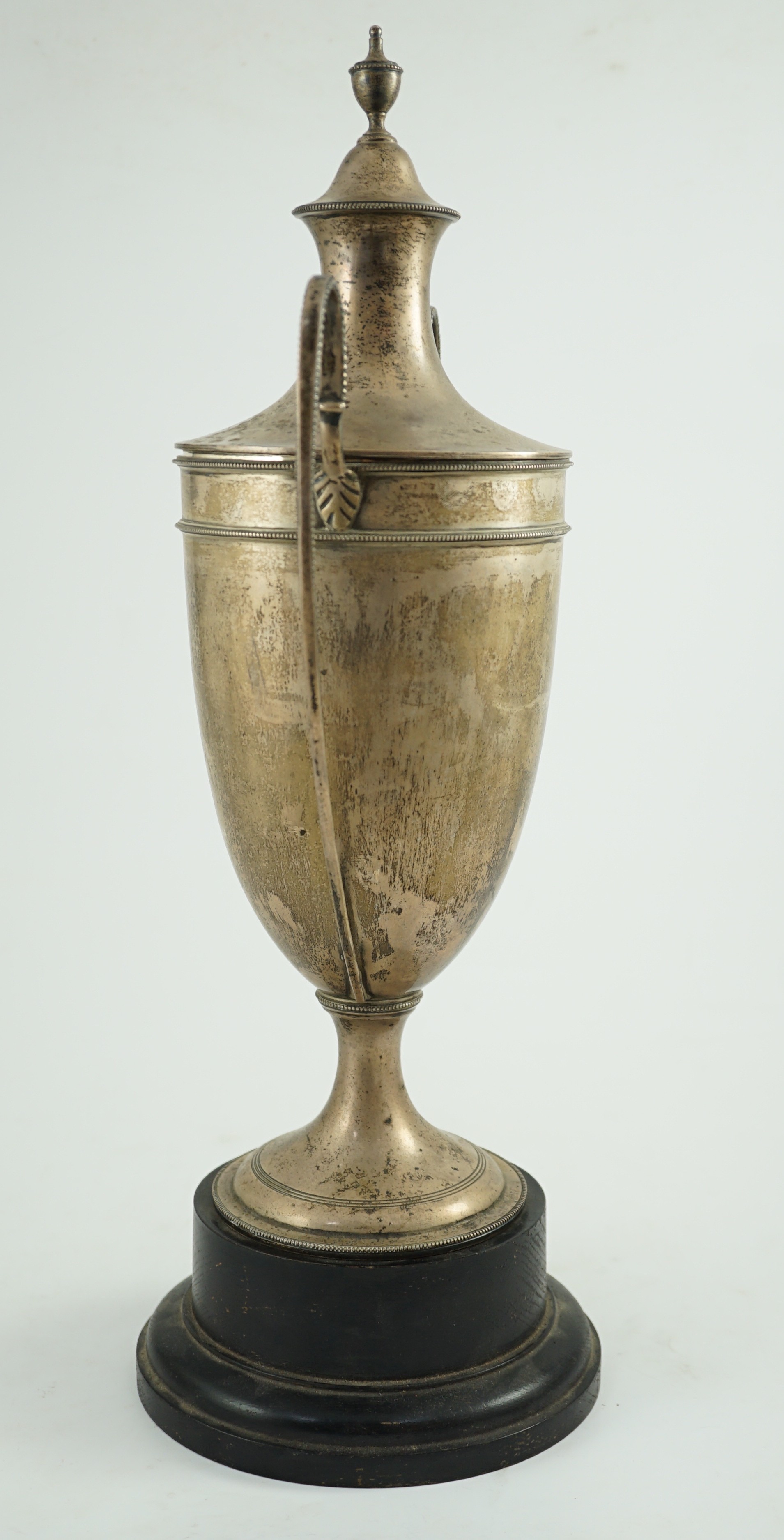 A George V silver two handled cup and cover by Sebastian Garrard